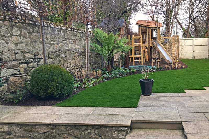 Bespoke children’s playtower, in mature garden setting.