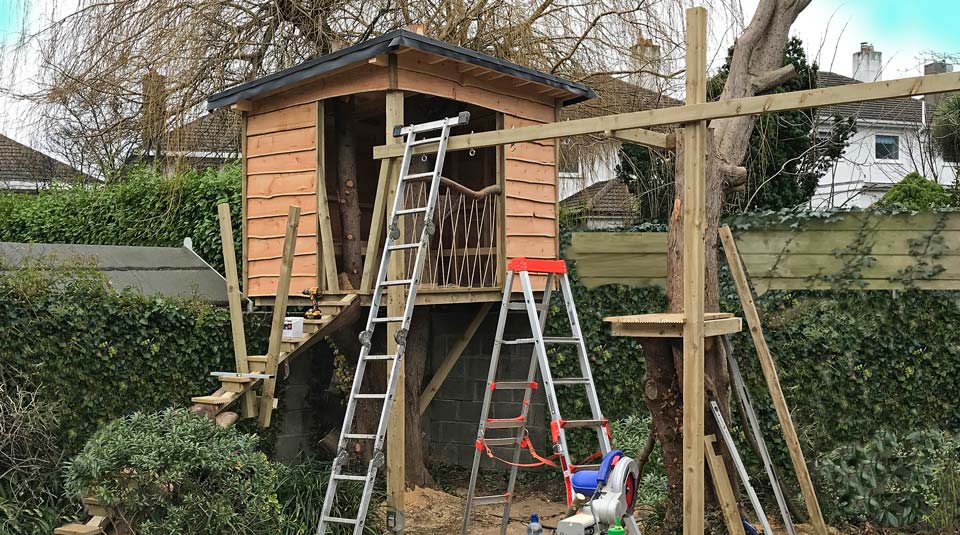 Treehouse play den & swings in a Dublin garden