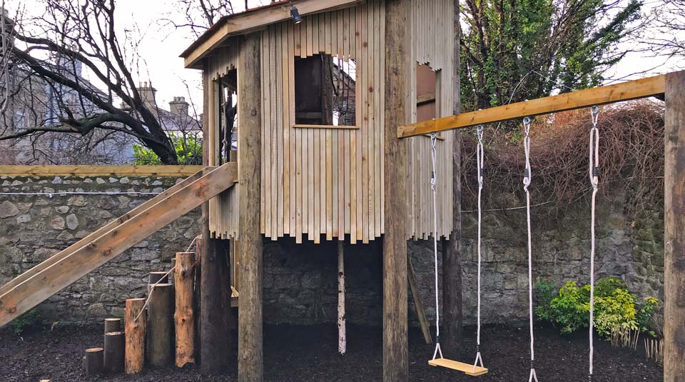 Fine detail in bespoke cladding and log steps to treehouse.